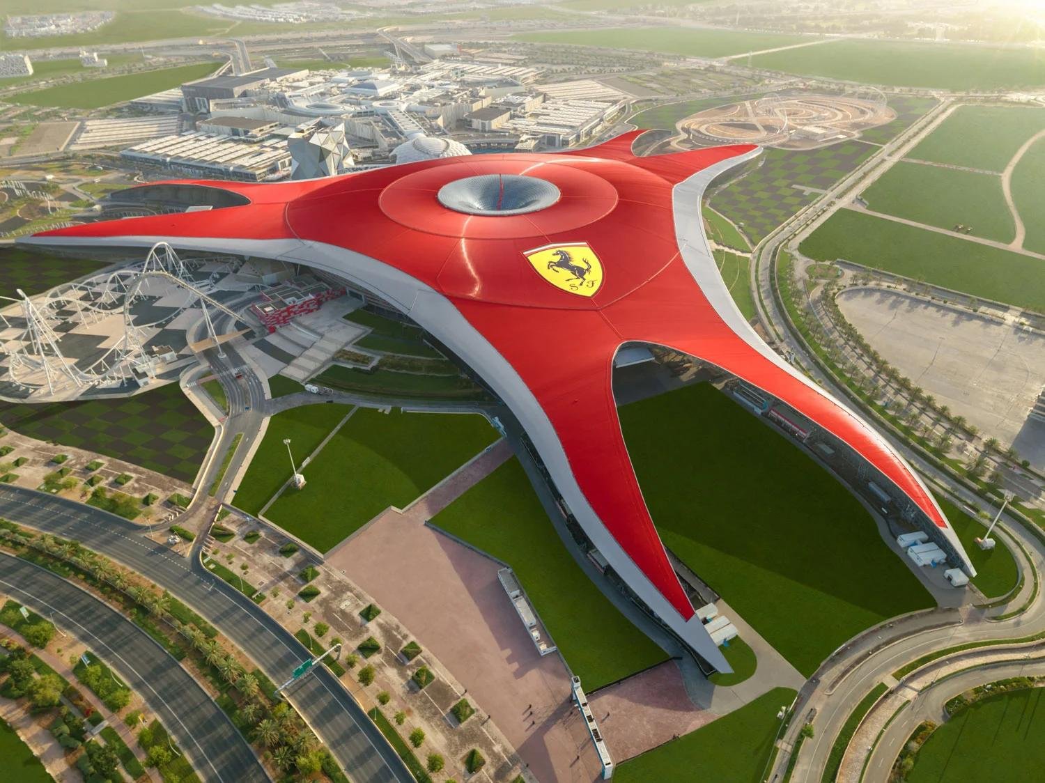 Ferrari World Abu Dhabi near Al Jurf Gardens featuring iconic theme park attractions and family entertainment destination.